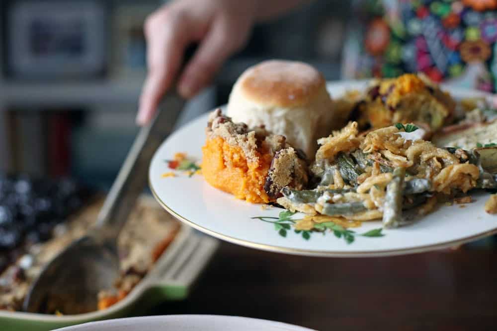a dinner plate filled with Thanksgiving foods
