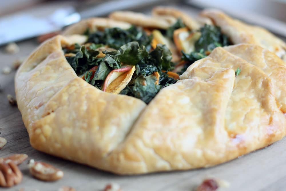 baked golden brown galette filled with kale, apple, and sweet potato