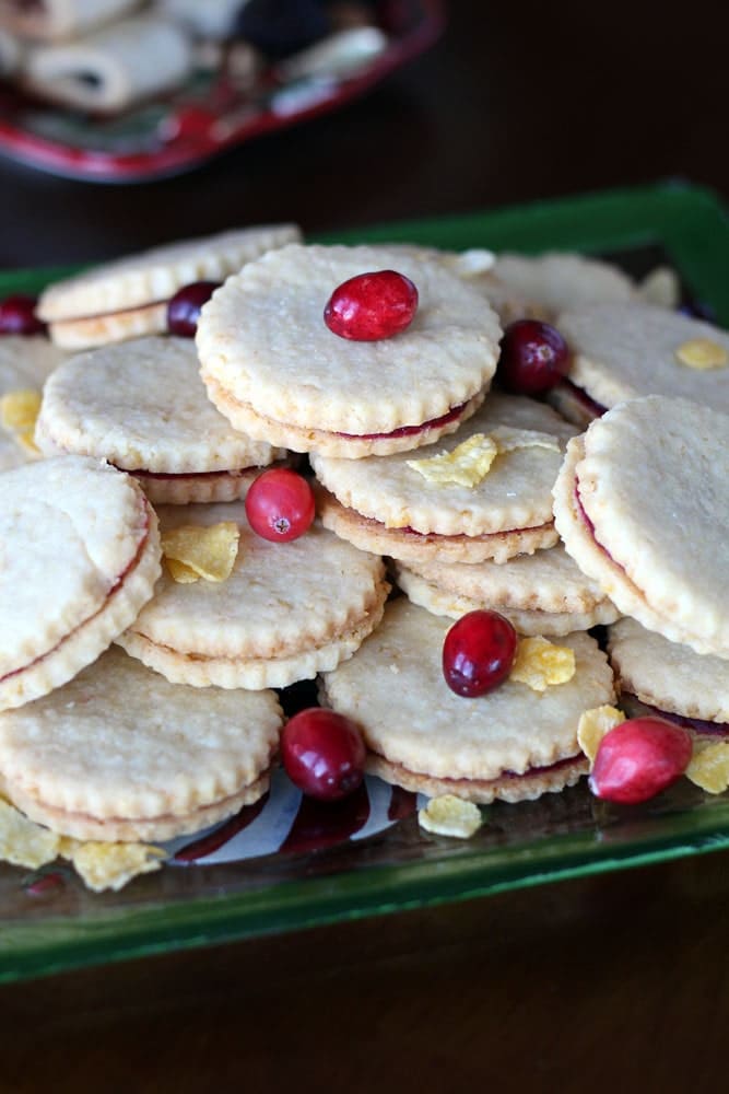 round sandwich cookies garnished with corn flake cereal and cranberries