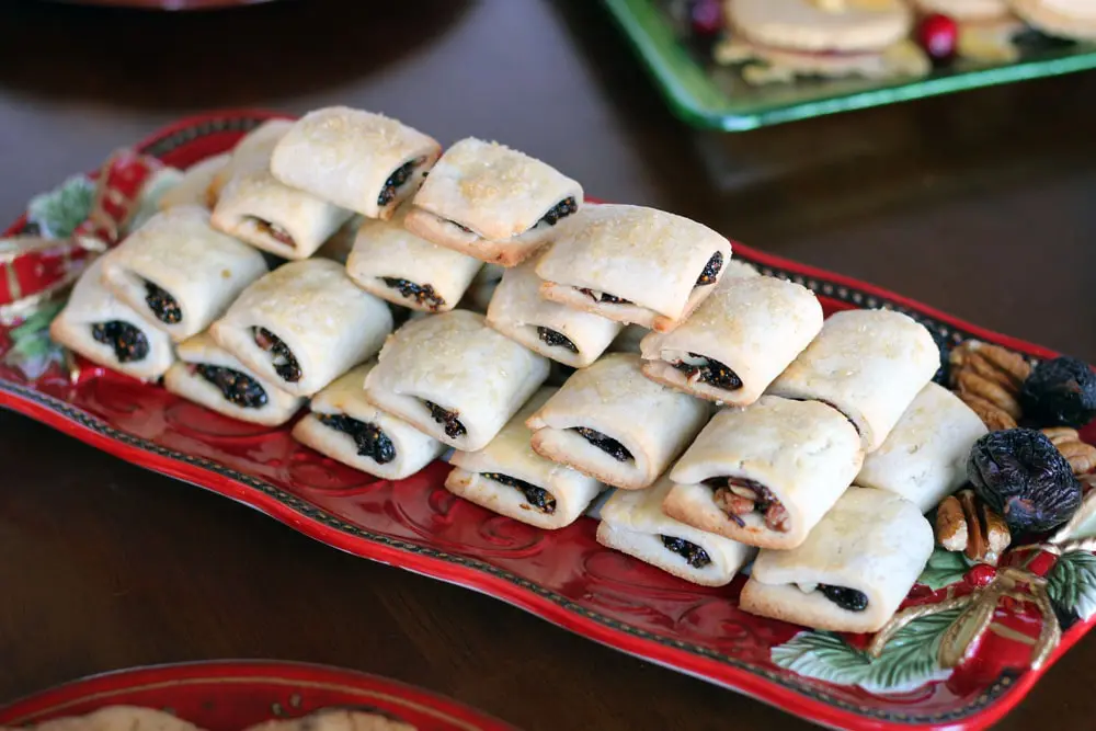 Fig Pecan Newton cookies stacked in a pyramid on a long red serving platter