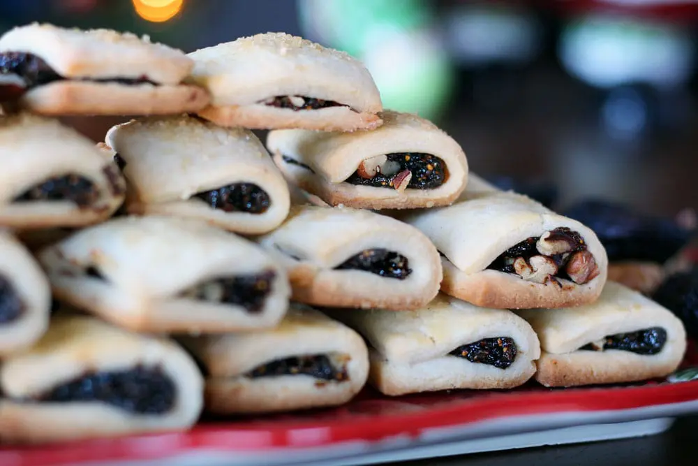 Fig Pecan Newton cookies stacked in a pyramid on a long red serving platter