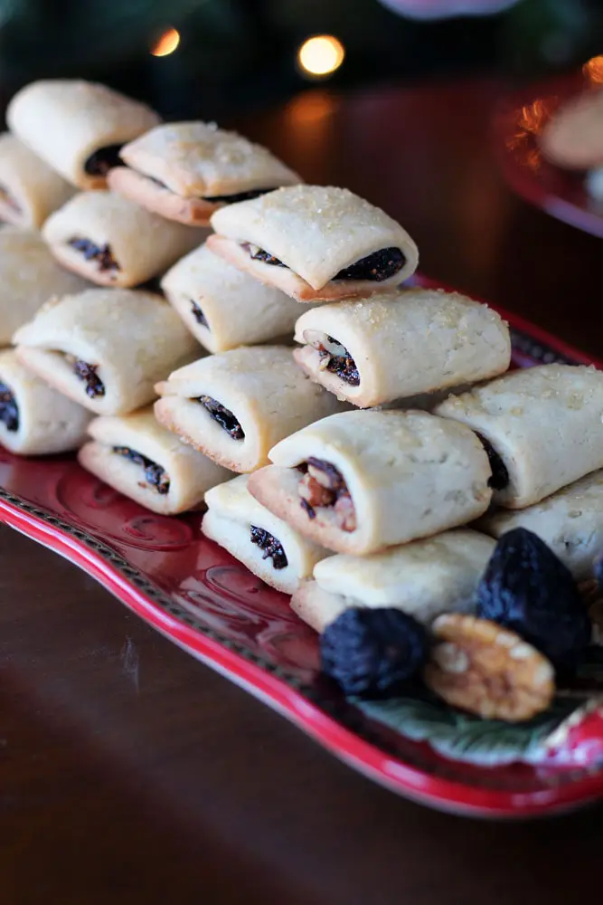 Fig Pecan Newton cookies stacked in a pyramid on a long red serving platter