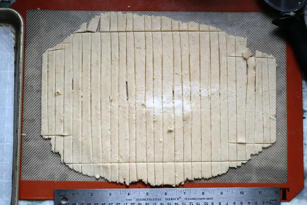 a sheet of pastry dough cut into long, narrow rectangles