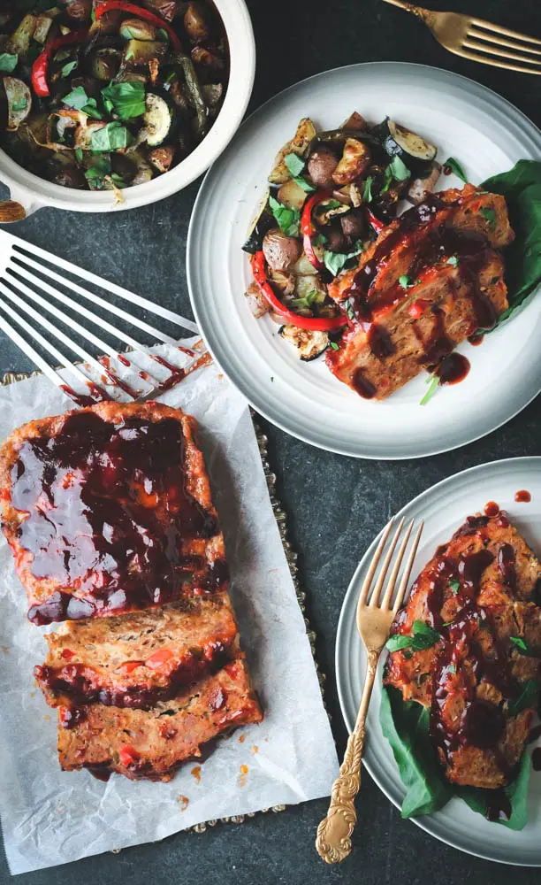 Sausage and Peppers Meatloaf with Italian Roasted Vegetables with two servings white plates with gray rim