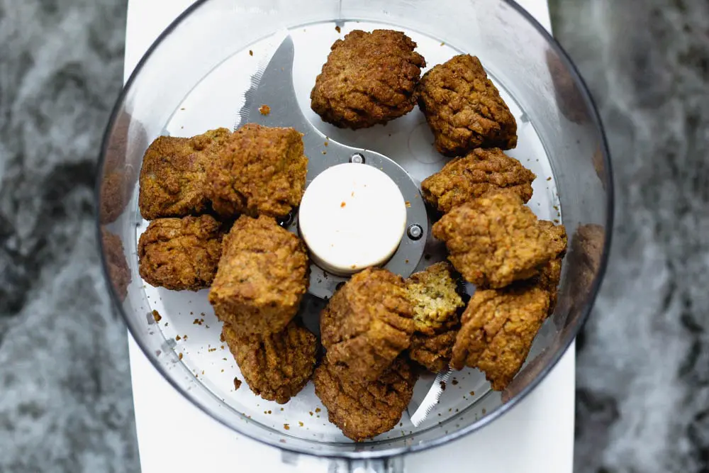 store bought falafel balls in a food processor being being pulsed