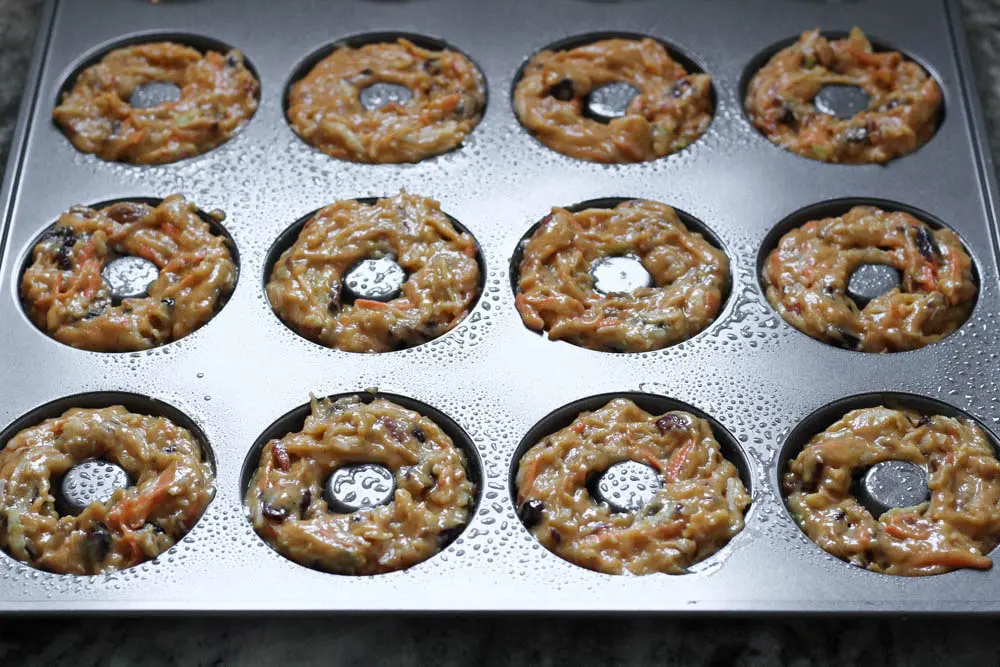 donut batter in the donut pan before baking