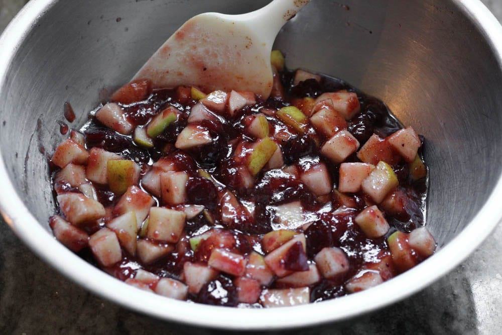 closeup of filling for Cranberry, Apple and Pear Bars being mixed in a stainless steel mixing bowl