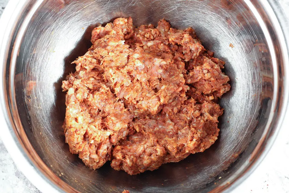 raw chorizo made from scratch in a stainless steel bowl