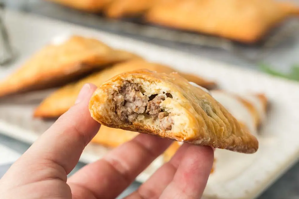 close up of Louisiana Meat Pie with a bite taken out of it
