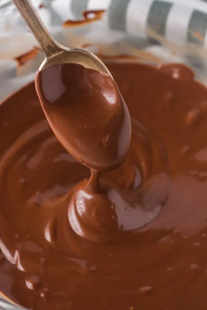 Melted chocolate closeup as it drips off a spoon