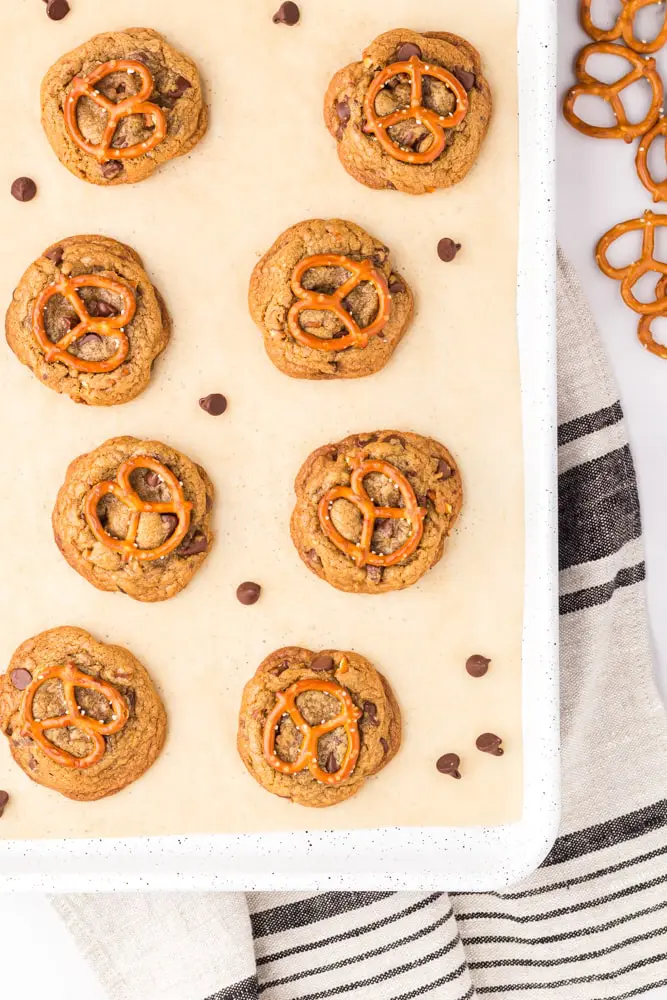 Brown Butter Chocolate Chip Cookies with Pretzels on a sheet pan lined with parchment paper after baking