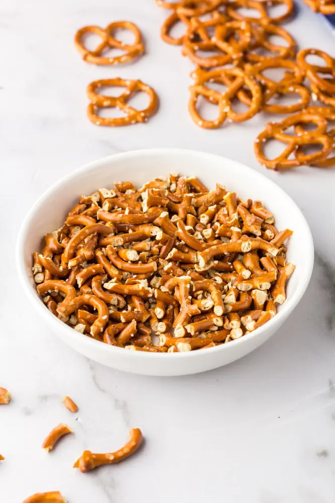 pretzel pieces in a white bowl