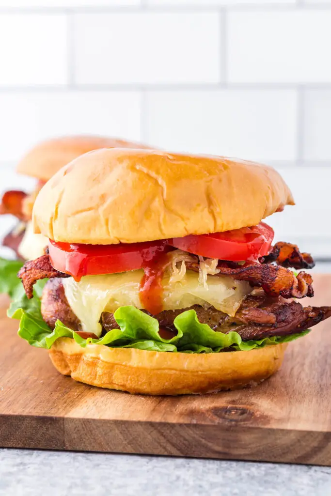 Hawaiian chicken sandwiches on a wooden cutting board