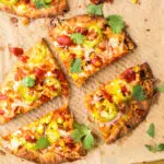 BBQ chicken flatbread cut into four equal pieces