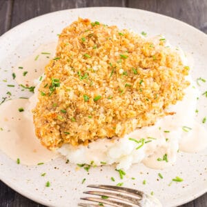 Close up of French Onion Pork Chops served over mashed potatoes.