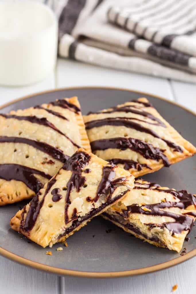 Chocolate Fudge pop-tart cut in half on a gray plate