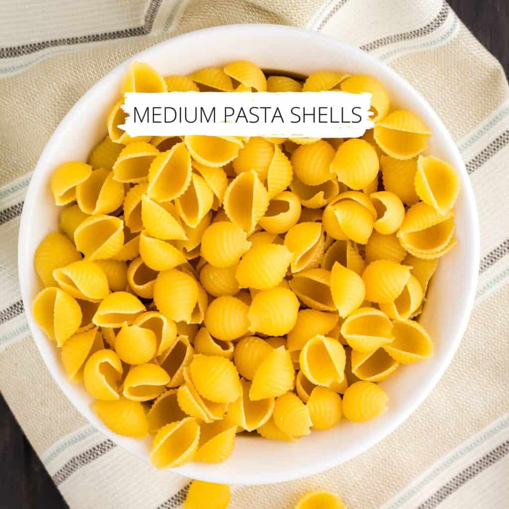 Close up of medium pasta shells for creamy garlic chicken pasta.