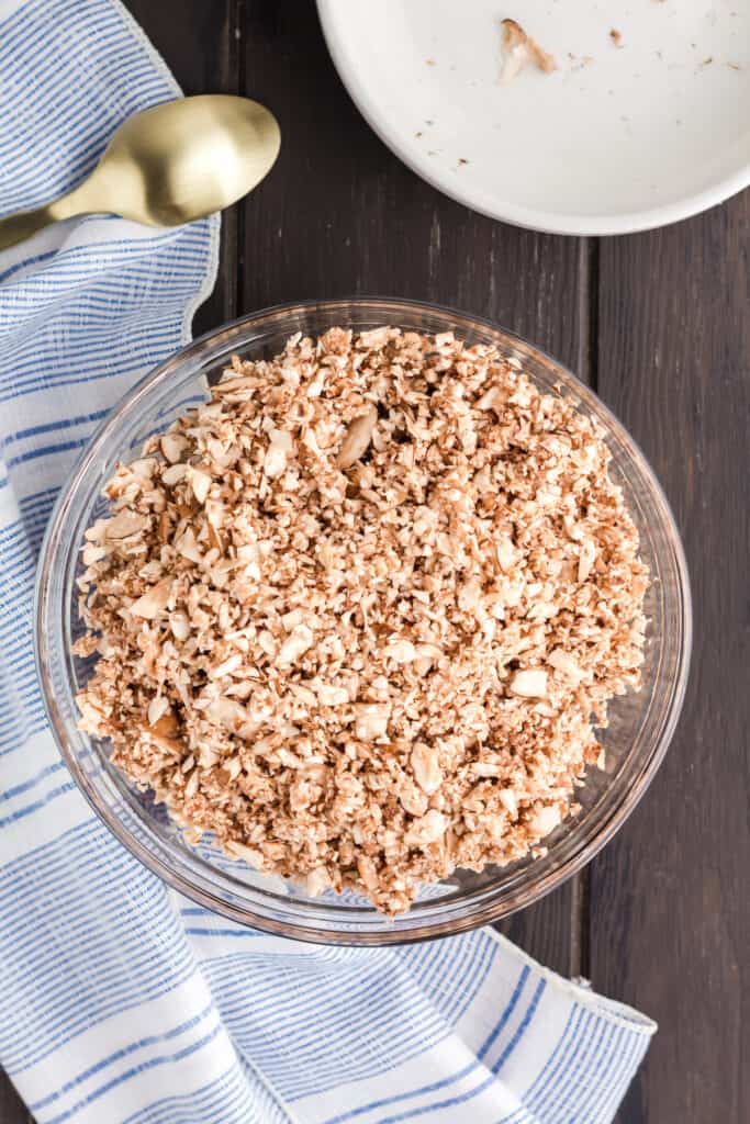 Glass bowl filled with finely minced mushrooms.