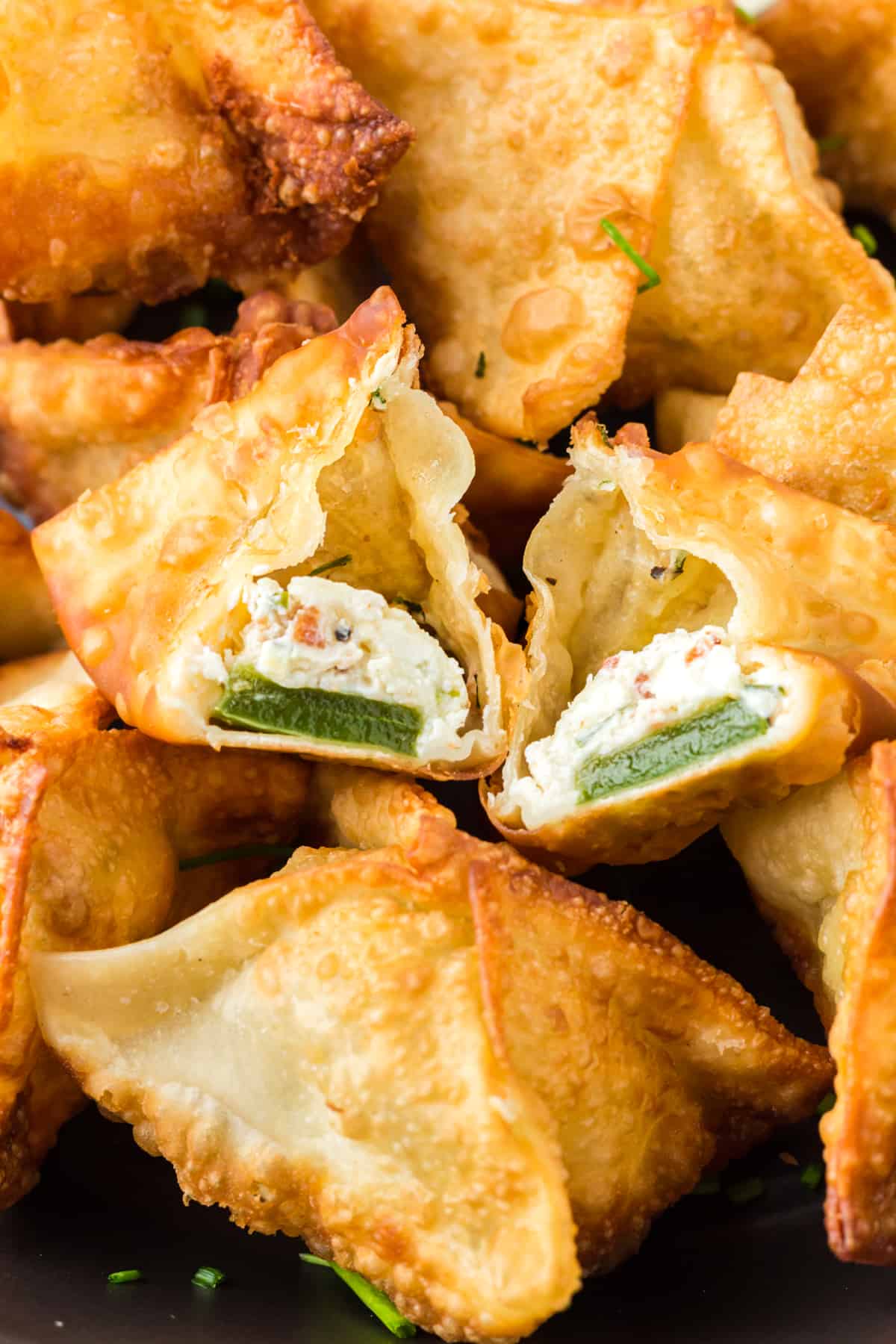 Jalapeno Popper Wonton split in half to reveal the inside.