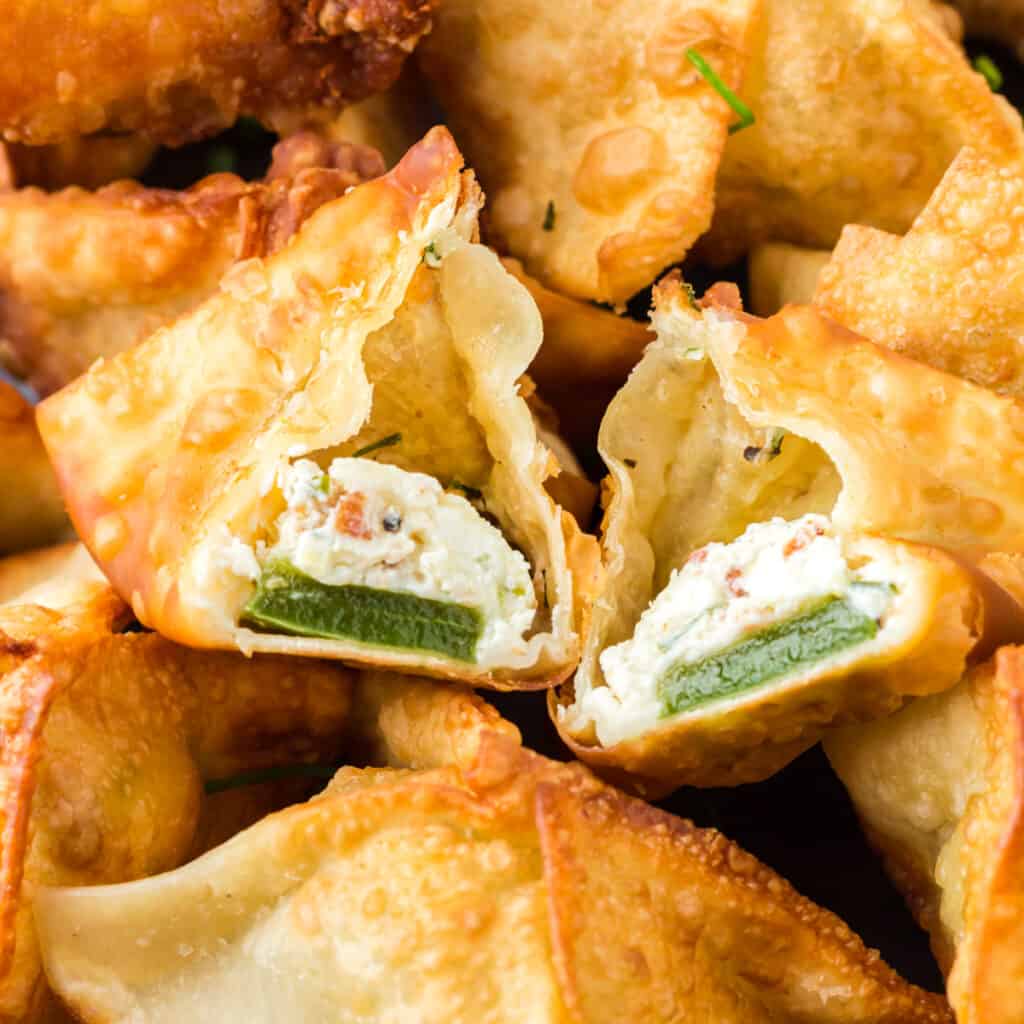 Jalapeno Popper Wonton split in half to reveal the inside.