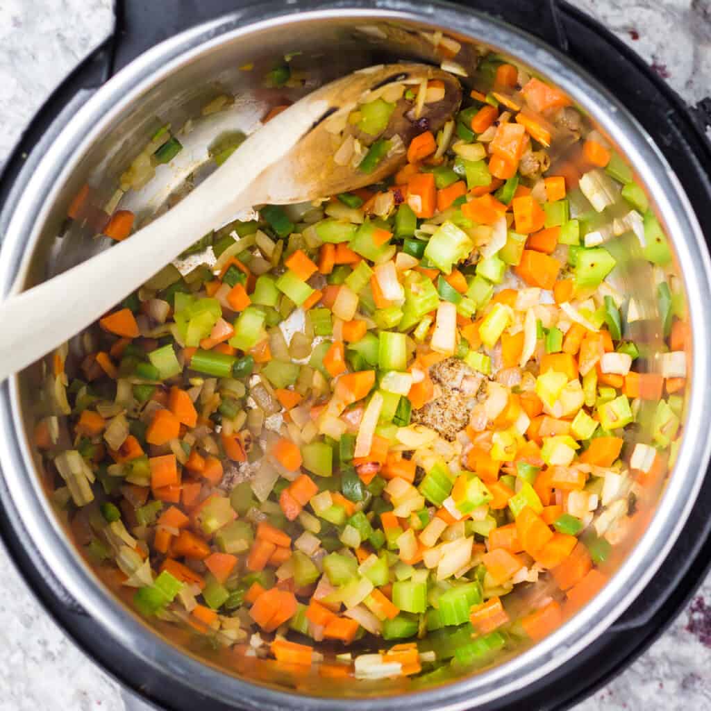 Vegetables sauteeing for butter beans.